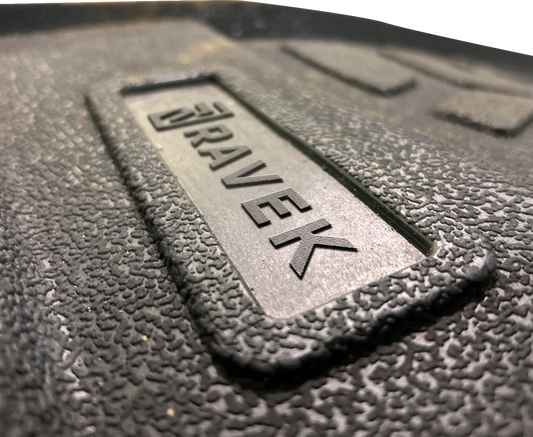 Custom molded black rubber floor mat installed in Can-Am Defender UTV interior